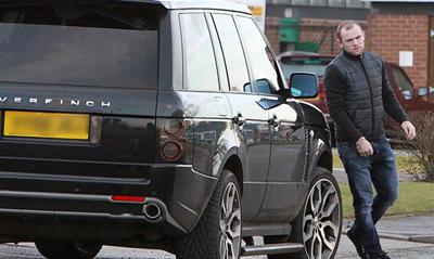 Wayne Rooney with his car